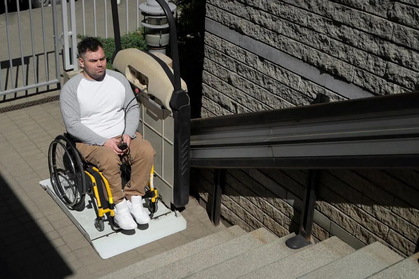 High-angle view of a man in a wheelchair outdoors
