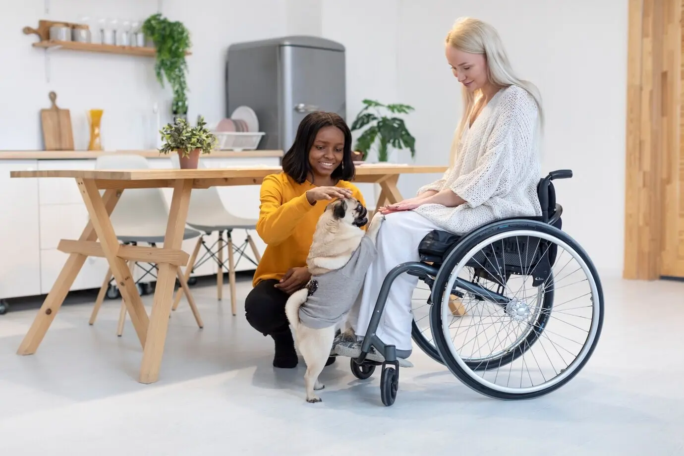 Full-length shot of smiling women petting a dog.